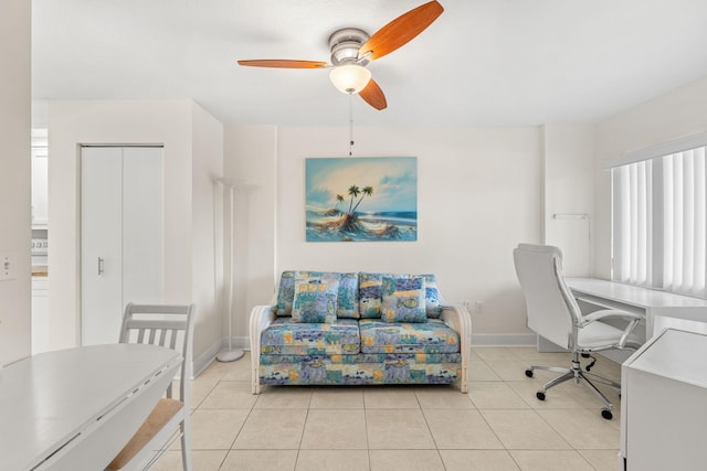 tiled home office featuring ceiling fan