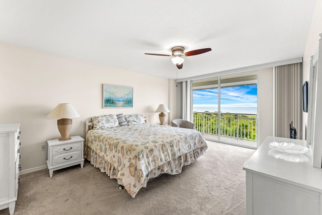 carpeted bedroom with access to exterior and ceiling fan