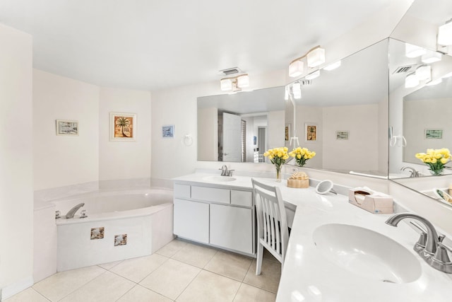 bathroom featuring tile patterned flooring, a tub to relax in, and dual bowl vanity