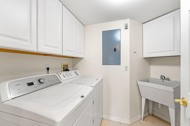 clothes washing area with light tile patterned flooring, independent washer and dryer, electric panel, and cabinets