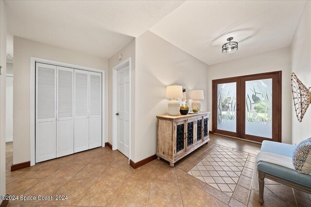 tiled foyer entrance with french doors