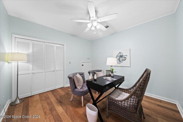 interior space featuring ceiling fan, dark hardwood / wood-style floors, and crown molding