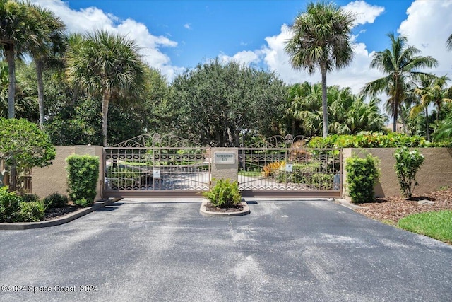 view of gate featuring fence