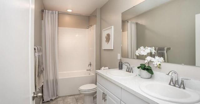 full bathroom with vanity, toilet, tile patterned flooring, and shower / bath combo with shower curtain