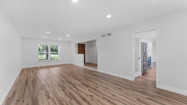 spare room with light hardwood / wood-style flooring