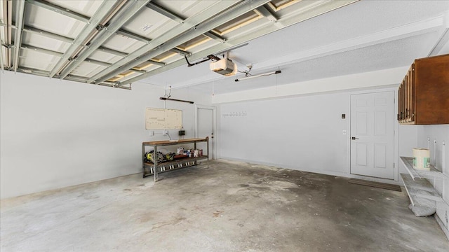 garage featuring a garage door opener