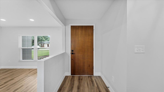 doorway with hardwood / wood-style floors