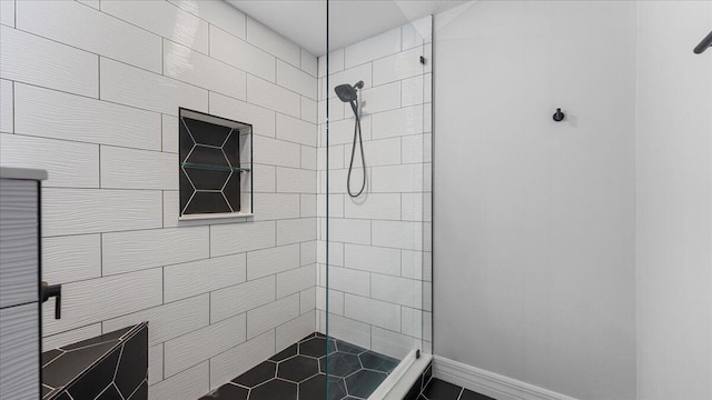 bathroom with a tile shower