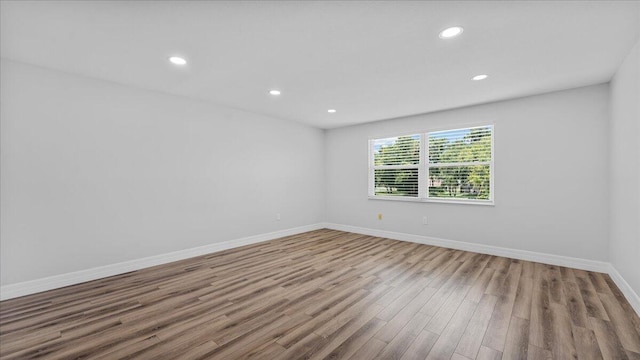 unfurnished room featuring light wood-type flooring