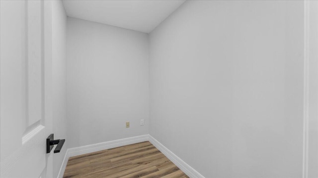 spare room with hardwood / wood-style flooring