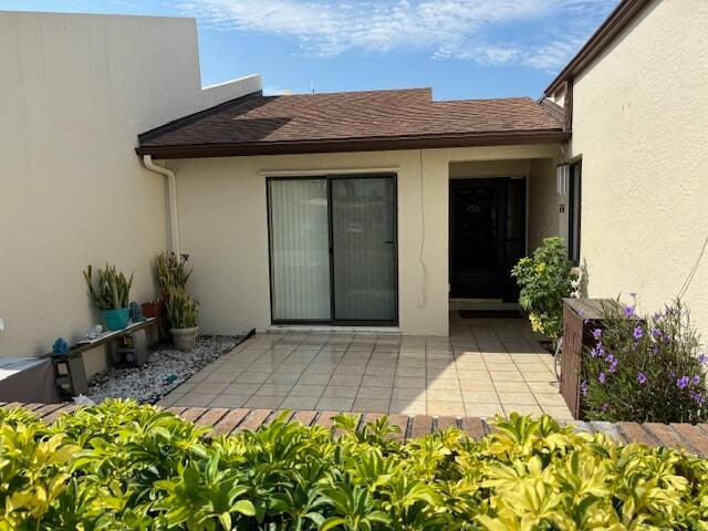 entrance to property with a patio area