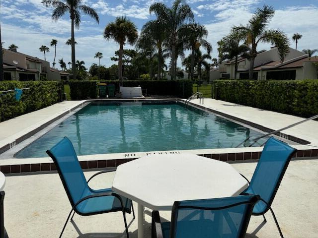 view of swimming pool with a patio area