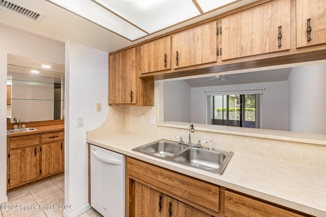 kitchen with ceiling fan, light tile patterned flooring, sink, and dishwasher