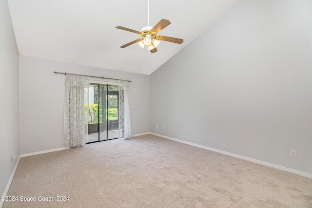 empty room featuring ceiling fan, high vaulted ceiling, baseboards, and light colored carpet