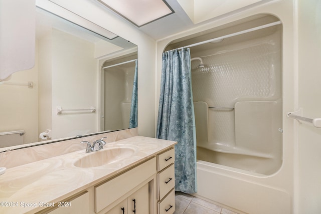 bathroom featuring tile patterned flooring, vanity, and shower / tub combo