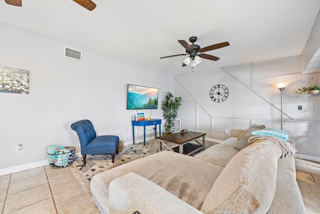 tiled living room featuring ceiling fan