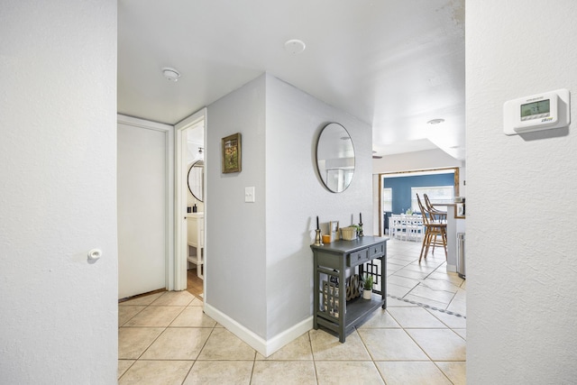 hallway with light tile patterned floors