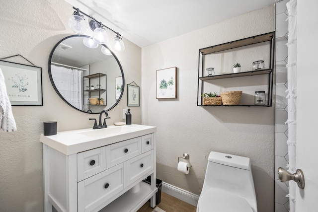 bathroom with vanity and toilet