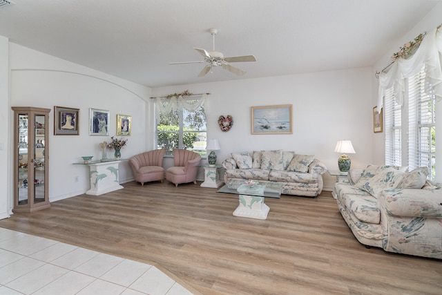 living room featuring light hardwood / wood-style floors and ceiling fan