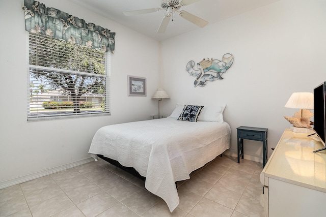 bedroom featuring ceiling fan and light tile patterned floors