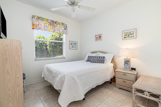 tiled bedroom with ceiling fan