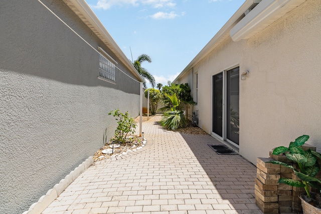 view of side of property featuring a patio area