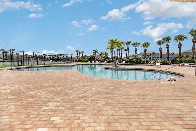 view of swimming pool featuring a patio area