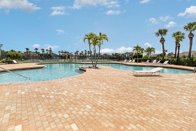 view of swimming pool with a patio area