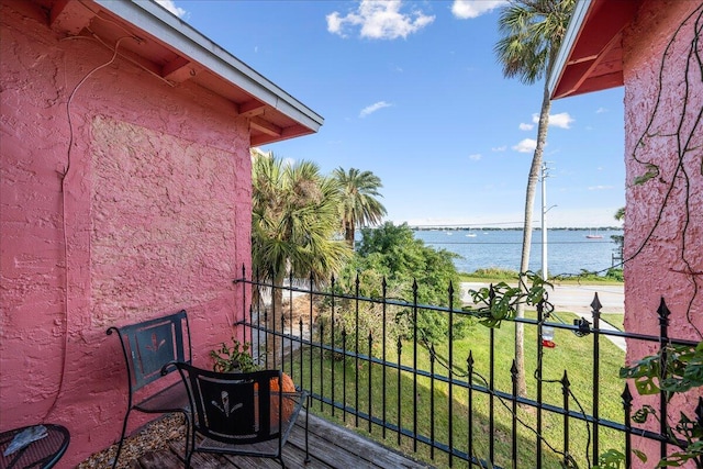 balcony featuring a water view