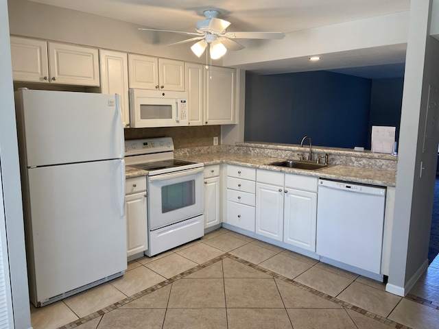 kitchen featuring sink, white appliances, light tile patterned floors, ceiling fan, and white cabinets