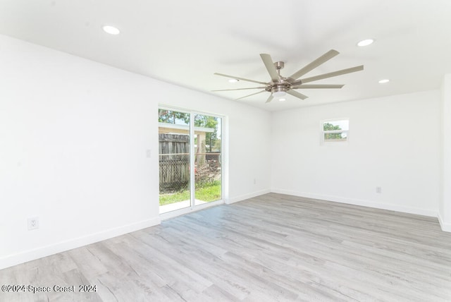 unfurnished room with ceiling fan, a healthy amount of sunlight, and light hardwood / wood-style flooring