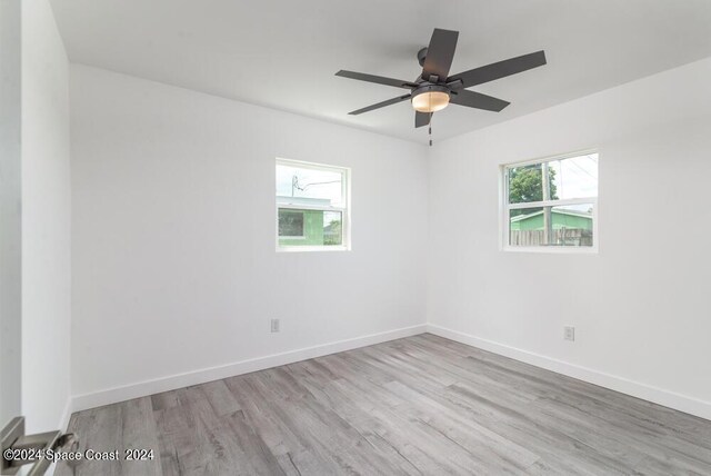 unfurnished room with ceiling fan and light hardwood / wood-style floors