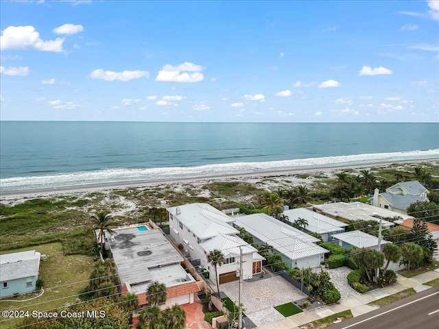 bird's eye view featuring a view of the beach and a water view