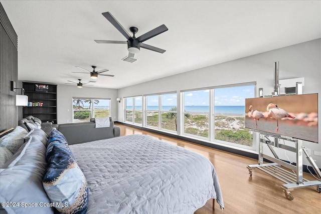 bedroom with light wood-type flooring and ceiling fan