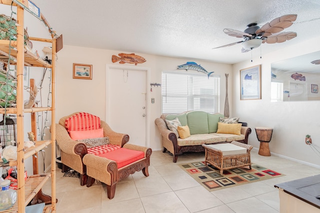 tiled living room with a textured ceiling and ceiling fan