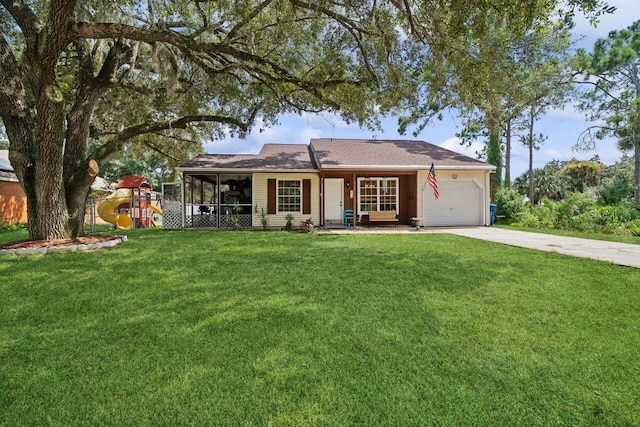 single story home with a garage and a front lawn