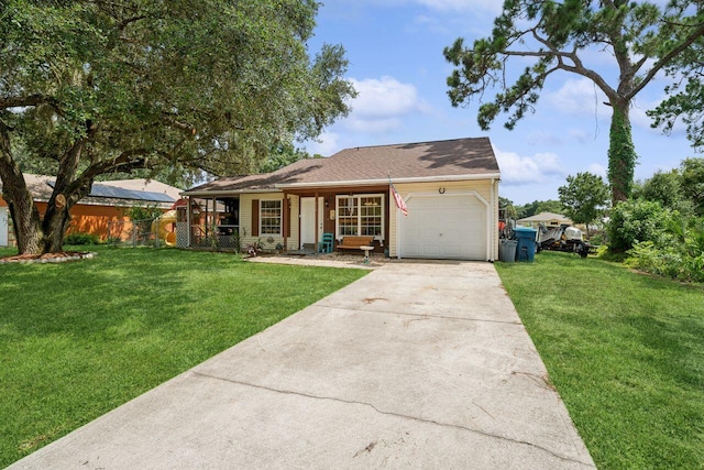 ranch-style house featuring a garage and a front yard