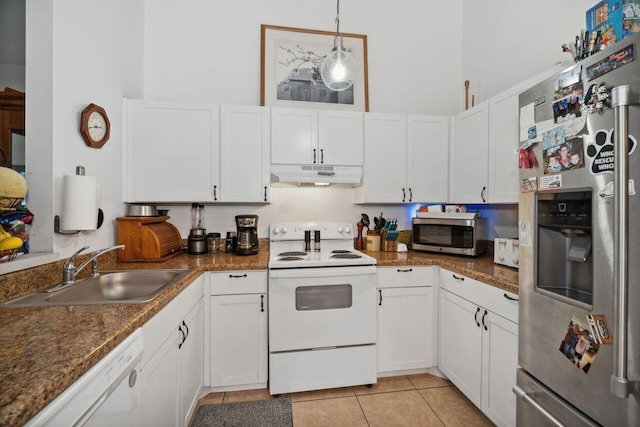 kitchen featuring pendant lighting, light tile patterned floors, appliances with stainless steel finishes, white cabinets, and sink