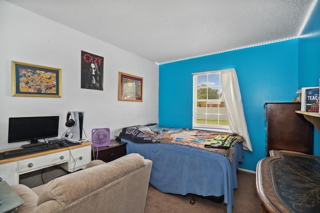 carpeted bedroom featuring a textured ceiling