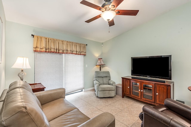 tiled living room featuring ceiling fan and lofted ceiling