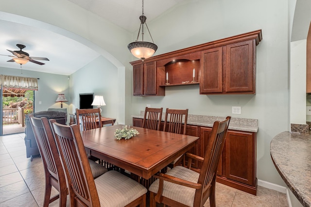 dining area featuring light tile patterned floors and ceiling fan