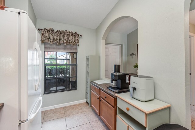 bathroom with tile patterned floors and vanity