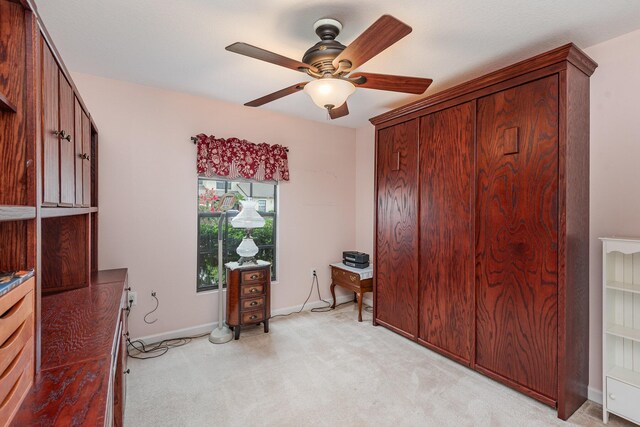 interior space featuring ceiling fan