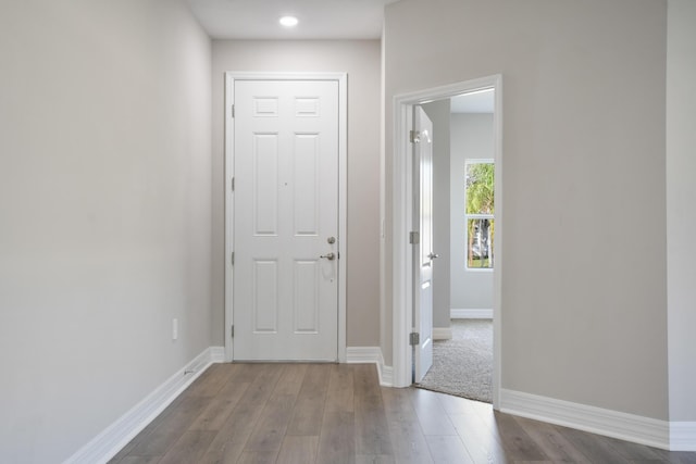 hall with light hardwood / wood-style floors