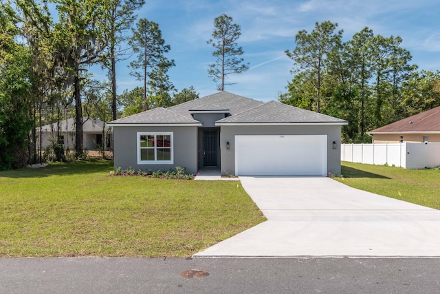 view of front of house with a garage and a front yard