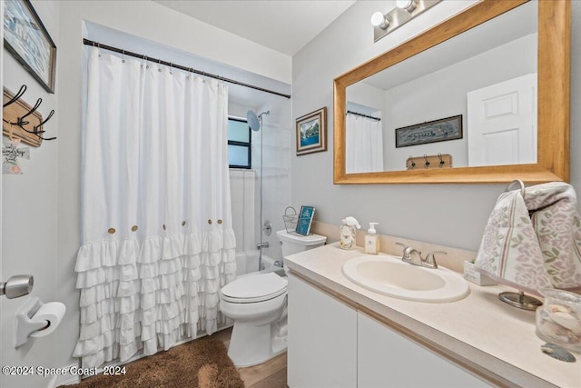 full bathroom featuring toilet, vanity, and shower / bath combination with curtain