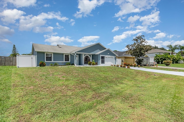 ranch-style house featuring a garage and a front lawn