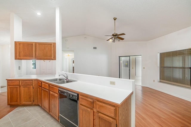 kitchen with sink, vaulted ceiling, light hardwood / wood-style flooring, dishwasher, and kitchen peninsula