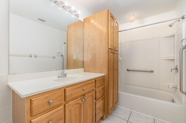 bathroom featuring tile patterned flooring, vanity, and shower / bathtub combination with curtain