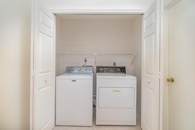 laundry area featuring washing machine and clothes dryer